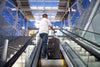 Caribee Adventure 70 luggage black on escalator