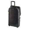Rear of Black rolling travel bag on a white background