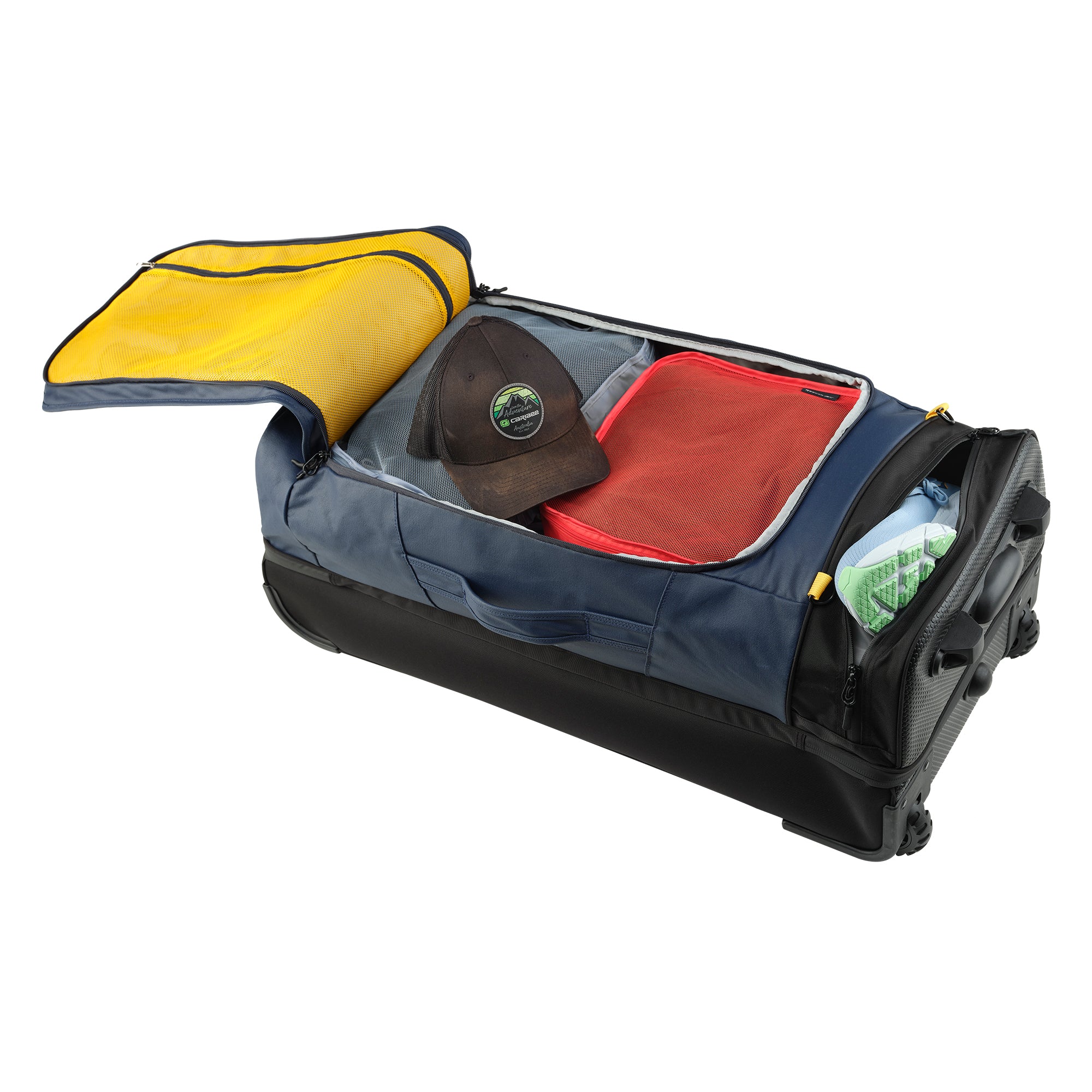 Caribee Odyssey travel bag open at the top level and also showing the base shoe pocket open with shoes inside
