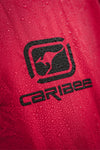 Close-up of a red fabric with a black logo and 'Caribee' text.
