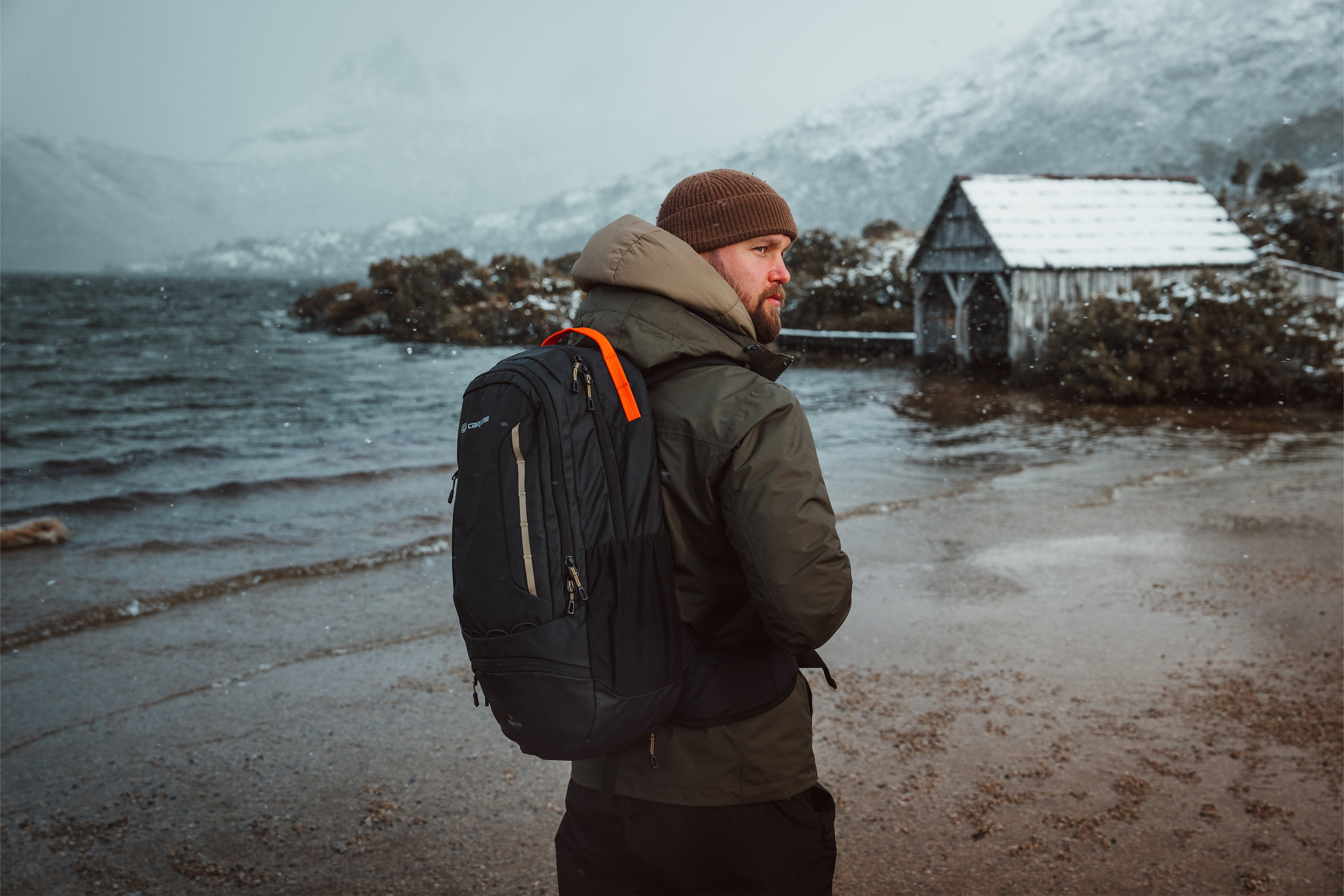 Urban Trek backpack by Caribee next to lake in winter