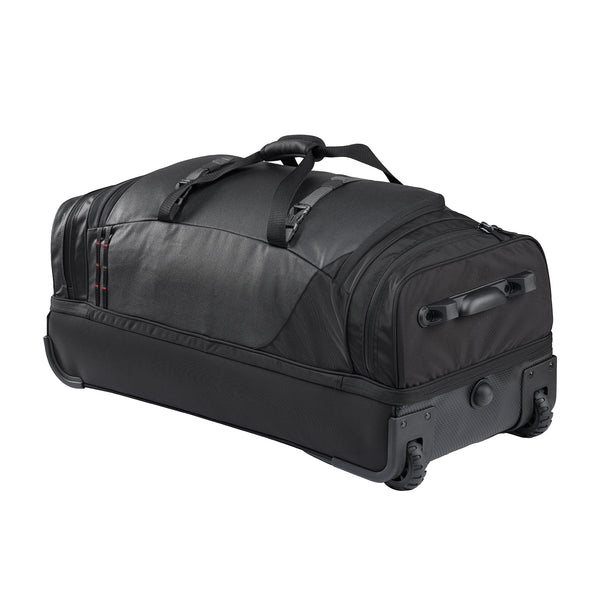 A black rolling duffel bag with a top carry handle, telescoping wheels, and a zippered compartment, shown on a plain white background.